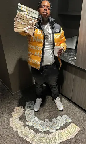 Finesse2tymes wearing Louis Vuitton belt