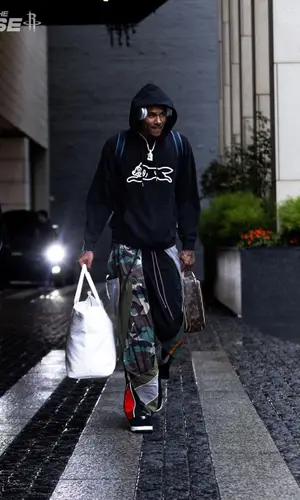 Jalen Green wearing Louis Vuitton bag