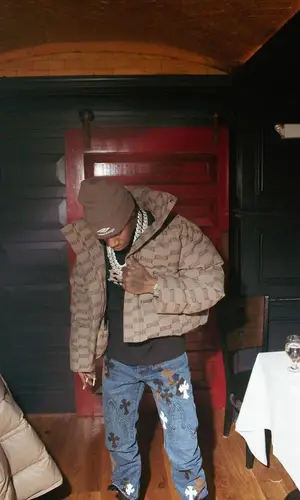 A Boogie Wit Da Hoodie wearing Bottega Veneta boots