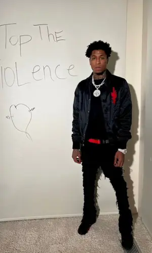 NBA YoungBoy wearing Christian Louboutin belt