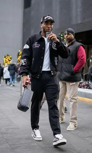Donovan Mitchell’s Outfit in Kith Jacket, Amiri Sneakers & Louis Vuitton Bag (2022)