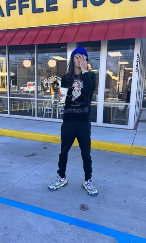 BabyTron wearing Adidas pants