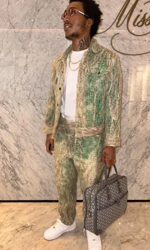 Lil Meech wearing Goyard bag