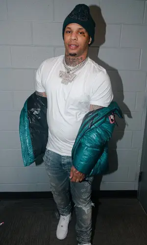Doodie Lo’s Outfit in Canada Goose Jacket, Amiri Jeans & Stone Island Hat (2022)