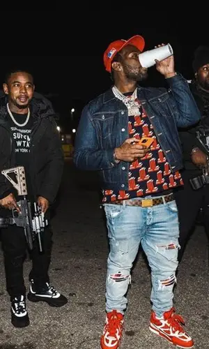 Peezy wearing Lanvin sweatshirt