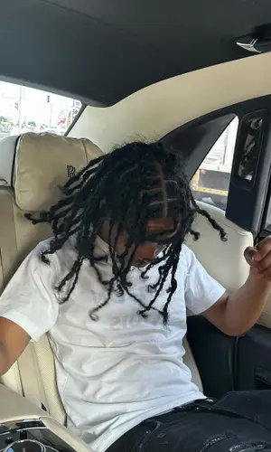Pressa wearing Amiri jeans