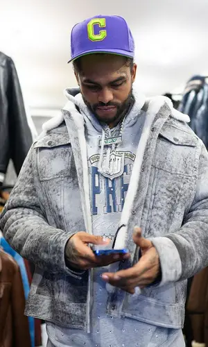 Dave East wearing New Era cap
