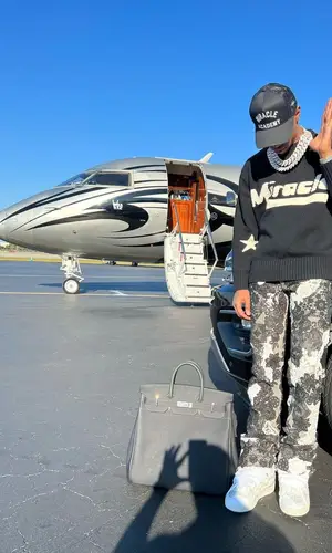 A Boogie Wit Da Hoodie wearing Nahmias sweater