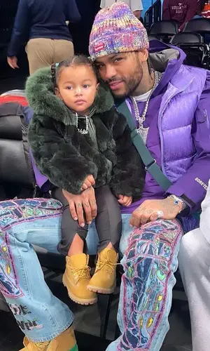 Dave East wearing Supreme hat