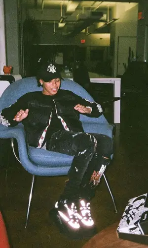 DD Osama wearing Chrome Hearts sweatshirt