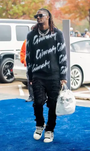CeeDee Lamb wearing Givenchy sweater