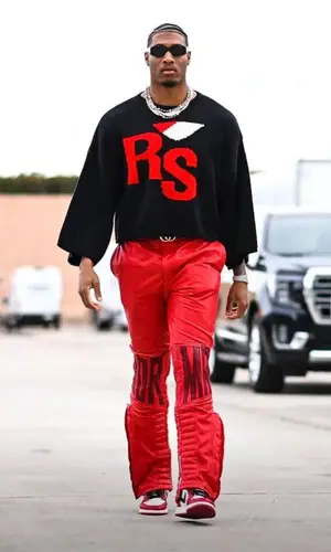 Isaiah Simmons wearing Raf Simons sweater