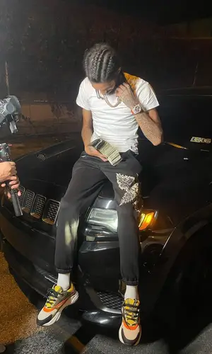 Ot7Quanny wearing Dior sneakers