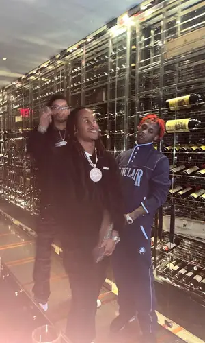 Rich The Kid wearing Sinclair pants