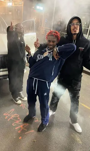 Jay Critch wearing Who Decides War jeans