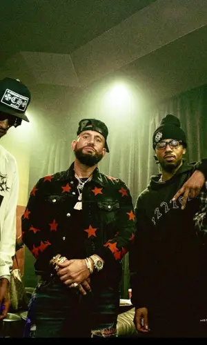DJ Drama wearing Amiri jacket