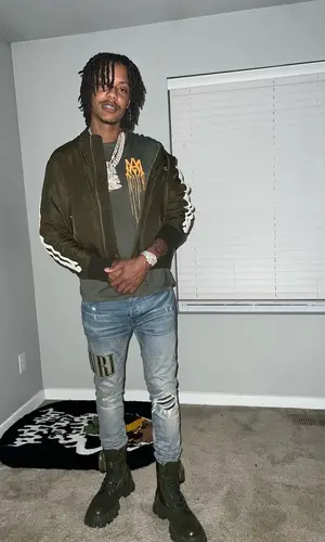 Skilla Baby wearing Amiri t-shirt