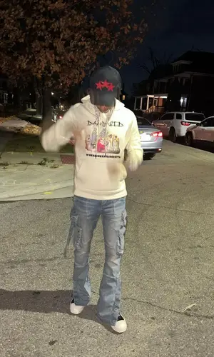 Skilla Baby wearing Amiri pants