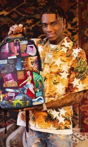 Soulja Boy wearing Sprayground bag
