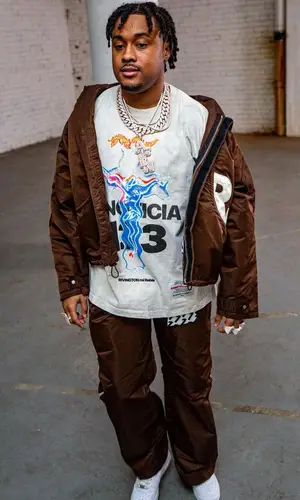 Tay B wearing Nike sneakers