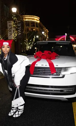 LightSkinKeisha wearing Loverboy by Charles Jeffrey hat