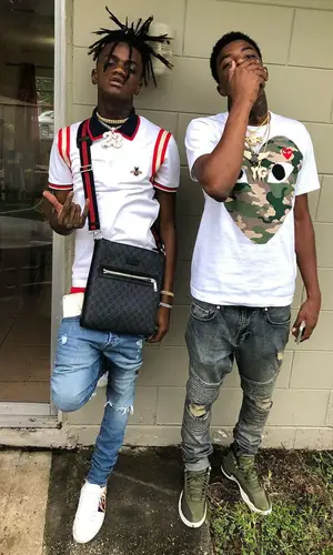 JayDaYoungan wearing Gucci sneakers