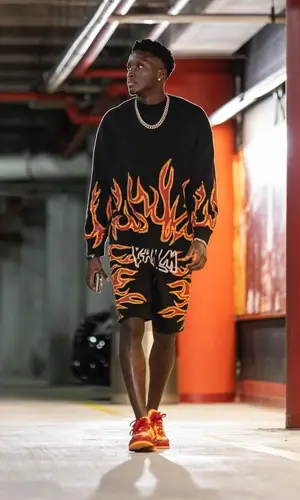 Victor Olapido wearing Palm Angels shorts