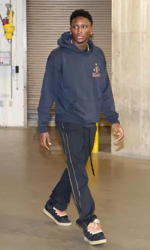 Victor Olapido wearing Rhude hoody