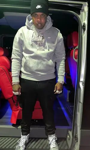 Finesse2tymes wearing Nike hoody
