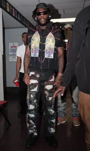 Burna Boy wearing Lanvin hat