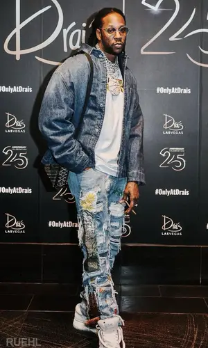2 Chainz wearing Goyard bag