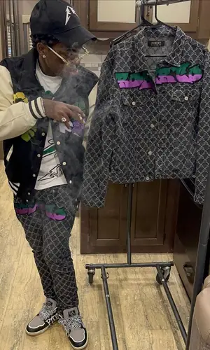 Kodak Black wearing Robert Roberto t-shirt