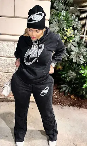 Renni Rucci wearing Filthy Wealth hoody