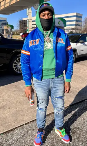 Peezy wearing New Era cap