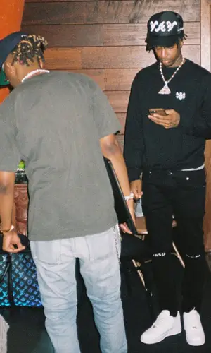 21 Savage wearing Nike sneakers