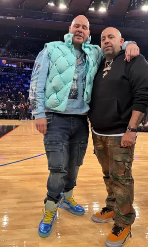 Fat Joe wearing Who Decides War sweater