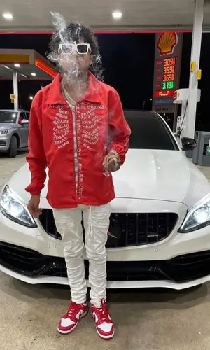 King Cid wearing Purple Brand jeans
