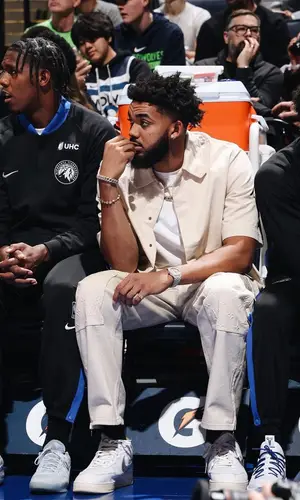 Karl Anthony Towns wearing Louis Vuitton shirt