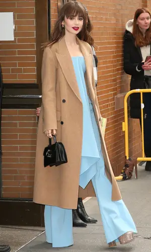Lily Collins wearing Valentino boots