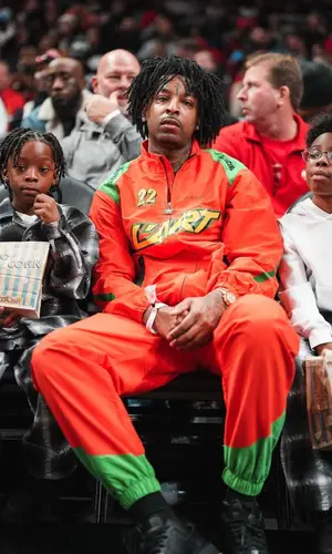 21 Savage wearing L'art De L'automobile pants