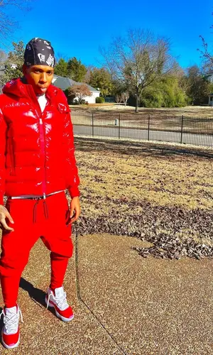 NLE Choppa wearing Nike hat