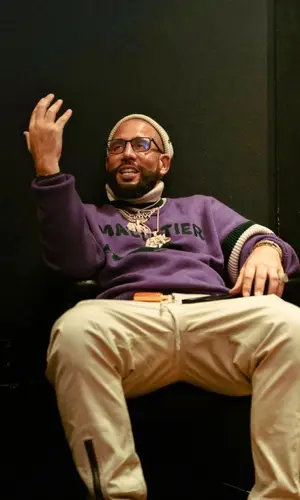DJ Drama wearing Louis Vuitton sweater
