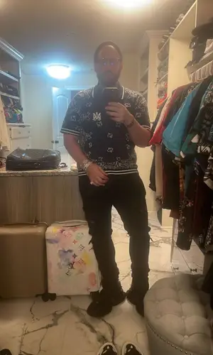 DJ Drama wearing Amiri jeans
