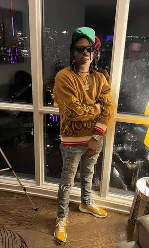 Duvy wearing Palm Angels sweater