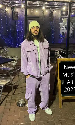 Russ wearing KidSuper jacket