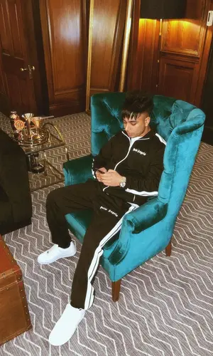 Gurinder Gill wearing Palm Angels jacket