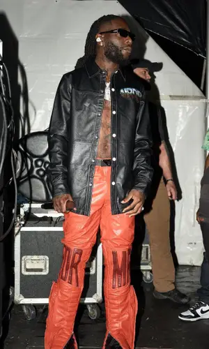 Burna Boy wearing Prada belt