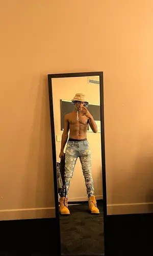 Lil Nas X’s Outfit in Amiri Jeans, Nike Hat & Chemist (2022)