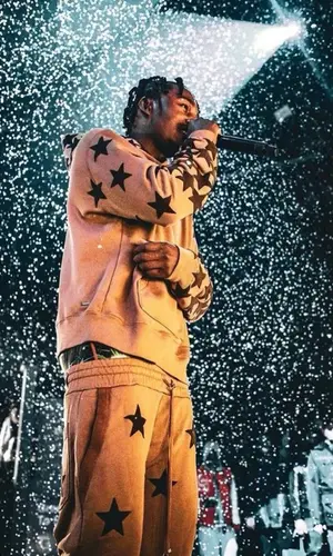 Lil Tjay wearing Amiri pants