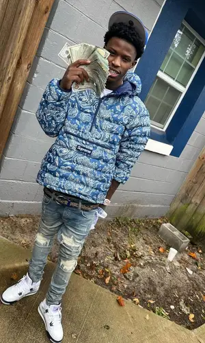 Quando Rondo wearing Supreme jacket